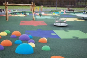 Impact-absorbing playground surfacing