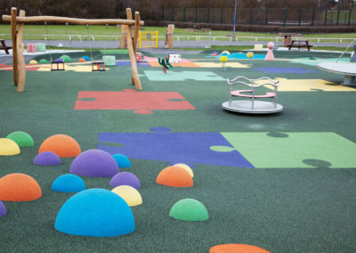 Impact-absorbing playground surfacing